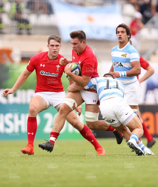 120618 -  Wales U20 v Argentina U20, World Rugby U20 Championship, 5th Place Semi Final - Taine Basham of Wales is held by Mateo Carreras of Argentina