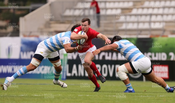 120618 -  Wales U20 v Argentina U20, World Rugby U20 Championship, 5th Place Semi Final - Cai Evans of Wales takes on Lucas Paulos of Argentina and Leonel Oviedo of Argentina