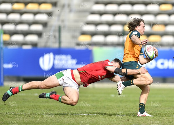 140723 - Wales U20 v Australia U20 - World Rugby Under 20 Championship 2023, 5th place play-off - Darby Lancaster of Australia tackled by Louie Hennessey of Wales