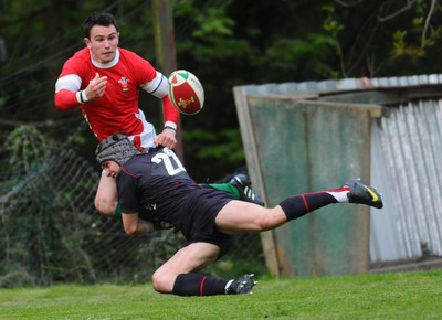 13.05.10 - Wales Under 20 v England Regional Academies XV  Wales Kristian Phillips passes as he is tackled 