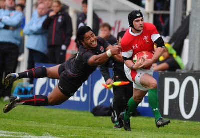 13.05.10 - Wales Under 20 v England Regional Academies XV  Wales' Adam Hughes breaks through on his way to score a try 