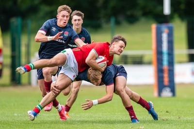 060625 - Wales U20 v England U20 - U20 World Championship Warm Up - Sion Davies of Wales is tackled by Will Knight of England