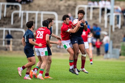 060625 - Wales U20 v England U20 - U20 World Championship Warm Up - Elis Price of Wales and Noah Caluori of England compete for the ball