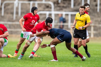 060625 - Wales U20 v England U20 - U20 World Championship Warm Up - Evan Minto of Wales is tackled by Noah Caluori of England