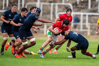 060625 - Wales U20 v England U20 - U20 World Championship Warm Up - Evan Minto of Wales is tackled by Noah Caluori of England