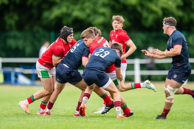 060625 - Wales U20 v England U20 - U20 World Championship Warm Up - Osian Darwin-Lewis of Wales is tackled by Nic Allison of England and Ben Coen of England