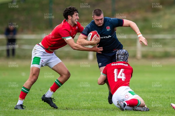 060625 - Wales U20 v England U20 - U20 World Championship Warm Up - George Timmins of England is tackled by Ioan Duggan of Wales and Elis Price of Wales