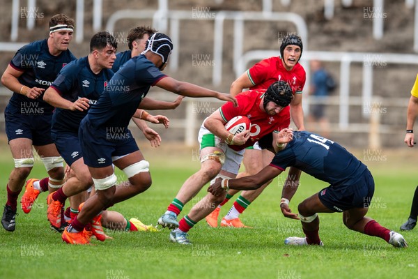 060625 - Wales U20 v England U20 - U20 World Championship Warm Up - Evan Minto of Wales is tackled by Noah Caluori of England