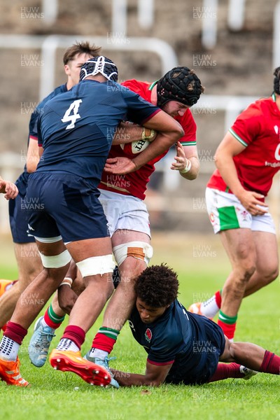 060625 - Wales U20 v England U20 - U20 World Championship Warm Up - Evan Minto of Wales is tackled by Noah Caluori of England and Aiden Ainsworth-Cave of England