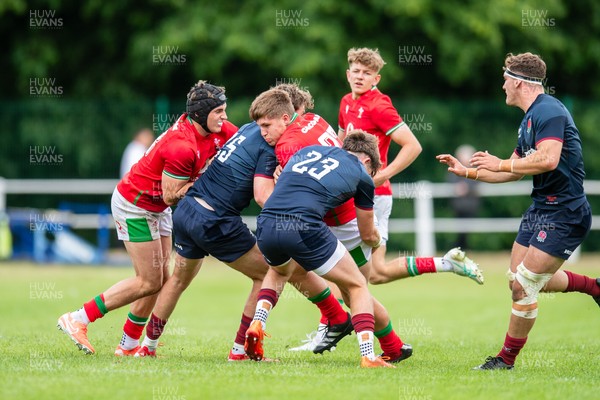 060625 - Wales U20 v England U20 - U20 World Championship Warm Up - Osian Darwin-Lewis of Wales is tackled by Nic Allison of England and Ben Coen of England