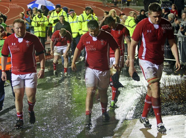 150313 Wales U20 v England U20 - Under 20s Six Nations - Welsh players look disappointed as they return to the changing rooms after the game 