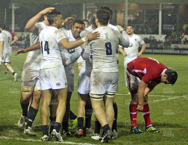 150313 Wales U20 v England U20 - Under 20s Six Nations - England's players celebrate victory as Wales players despair 