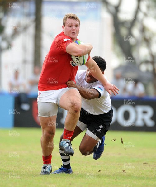 120619 - Wales U20 v Fiji U20 - World Rugby Under 20 Championship -  Dewi Lake of Wales hands off a Fiji tackler