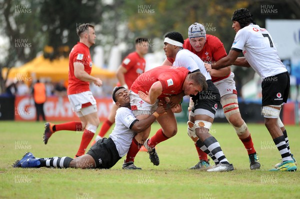 120619 - Wales U20 v Fiji U20 - World Rugby Under 20 Championship -  Tom Devine of Wales is tackled by Lino Mairara (left)