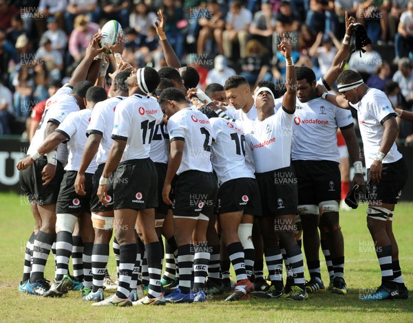 120619 - Wales U20 v Fiji U20 - World Rugby Under 20 Championship -  Fiji players gather in customary prayer and solidarity just before kick off 