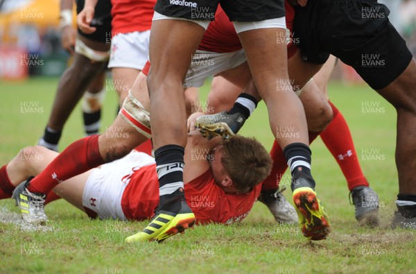 120619 - Wales U20 v Fiji U20 - World Rugby Under 20 Championship -  Sam Costelow of Wales appears to get a boot in the face