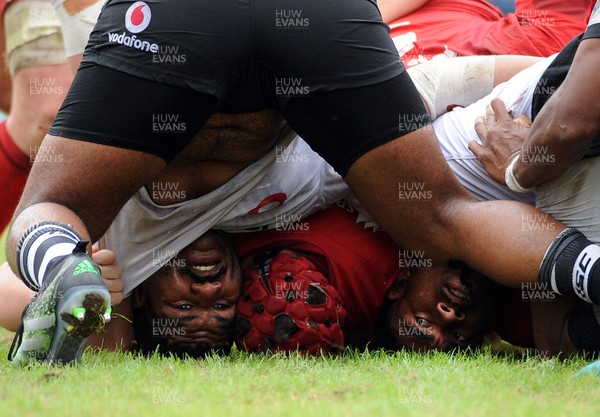 120619 - Wales U20 v Fiji U20 - World Rugby Under 20 Championship -  Emosi Tuqiri and hooker Lino Mairara of Fiji are caught upside down in a collapsed scrum