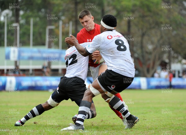 120619 - Wales U20 v Fiji U20 - World Rugby Under 20 Championship -  Deon Smith of Wales is tackled by Taniela Soqonawasaloa (12) and number 8 Eparama Sailo