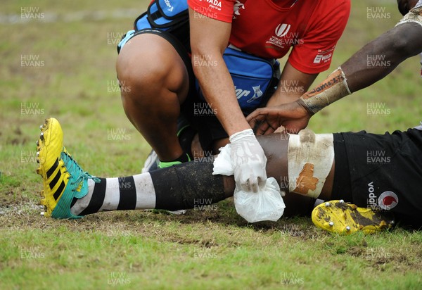 120619 - Wales U20 v Fiji U20 - World Rugby Under 20 Championship -  Fiji U20 player receives treatment from the medics