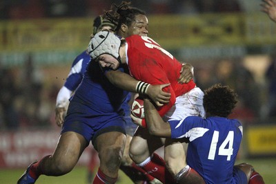 14.03.08 ..  Wales U20 v France U20, U20 Six Nations, Newport -  Wales' Jonathan Davies is held by France's Benjamin Fall  and France's Mathieu Basteraud  