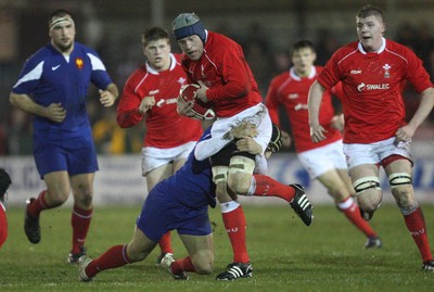 14.03.08 ..  Wales U20 v France U20, U20 Six Nations, Newport -  Wales' Lloyd Phillips is tackled by France's Mathieu Belie 