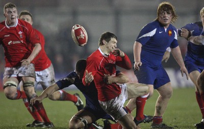 14.03.08 ..  Wales U20 v France U20, U20 Six Nations, Newport -  Wales' Daniel Biggar loses the ball as he's brought down  