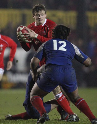 14.03.08 ..  Wales U20 v France U20, U20 Six Nations, Newport -  Wales' Daniel Biggar takes on France's Mathieu Belie and Mathieu Basteraud  