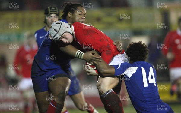 14.03.08 ..  Wales U20 v France U20, U20 Six Nations, Newport -  Wales' Jonathan Davies is held by France's Benjamin Fall  and France's Mathieu Basteraud  