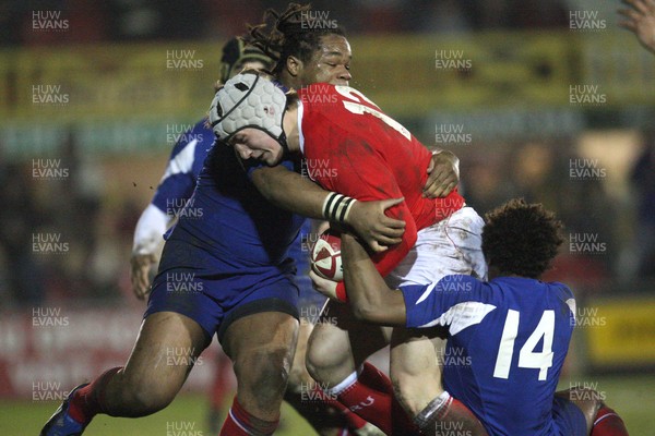 14.03.08 ..  Wales U20 v France U20, U20 Six Nations, Newport -  Wales' Jonathan Davies is held by France's Benjamin Fall  and France's Mathieu Basteraud  