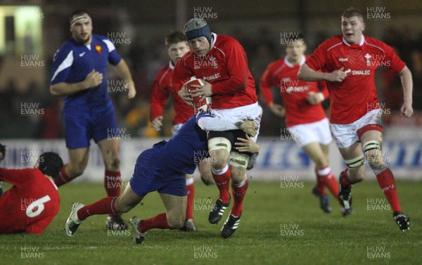 14.03.08 ..  Wales U20 v France U20, U20 Six Nations, Newport -  Wales' Lloyd Phillips is tackled by France's Mathieu Belie 