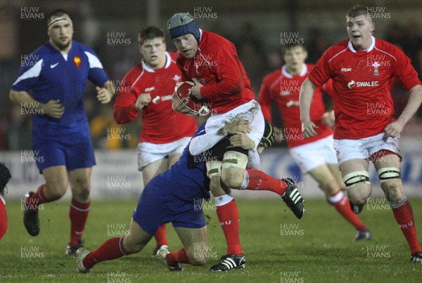 14.03.08 ..  Wales U20 v France U20, U20 Six Nations, Newport -  Wales' Lloyd Phillips is tackled by France's Mathieu Belie 