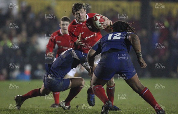 14.03.08 ..  Wales U20 v France U20, U20 Six Nations, Newport -  Wales' Daniel Biggar takes on France's Mathieu Belie and Mathieu Basteraud  