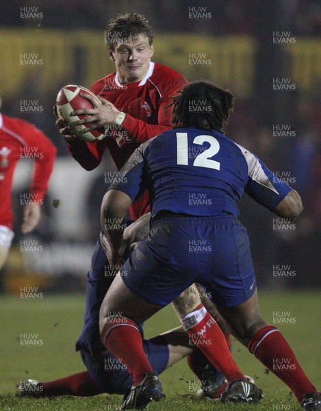 14.03.08 ..  Wales U20 v France U20, U20 Six Nations, Newport -  Wales' Daniel Biggar takes on France's Mathieu Belie and Mathieu Basteraud  