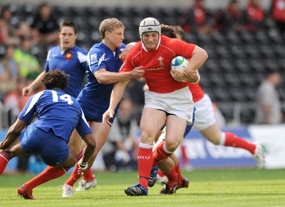 14.06.08 - Wales Under 20s v France Under 20s - Junior World Championship 2008 - Wales' Jonathan Davies is tackled by France's Guillaume Namy. 