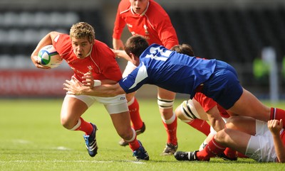 14.06.08 - Wales Under 20s v France Under 20s - Junior World Championship 2008 - Wales' Rhys Webb is tackled by France's Henry Chavancy. 