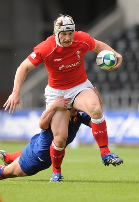 14.06.08 - Wales Under 20s v France Under 20s - Junior World Championship 2008 - Wales' Jonathan Davies is tackled by France's Henry Chavancy 
