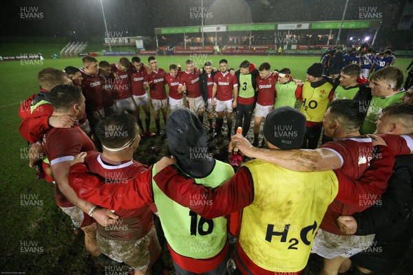 210220 - Wales U20 v France U20, U20 Six Nations Championship - The Welsh team huddle together at the end of the match