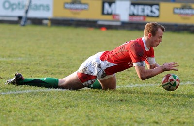 26.02.10 - Six Nations Under 20 Championship, Wales Under 20 v France Under 20 Wales' Dan Fish dives on the ball to score a try 