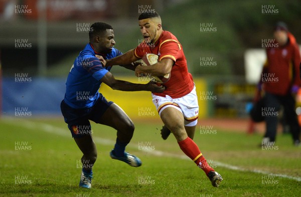 270216 - Wales Under 20 v France Under 20 - Under 20 Six Nations 2016 -Keelan Giles of Wales is tackled by Eliott Roudil of France