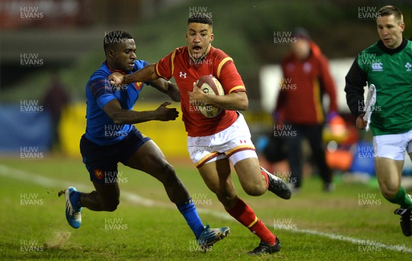 270216 - Wales Under 20 v France Under 20 - Under 20 Six Nations 2016 -Keelan Giles of Wales is tackled by Eliott Roudil of France