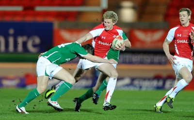 11.03.11 - Wales Under 20 v Ireland Under 20 - Under 20 Six Nations - Ben John of Wales takes on Craig Gilroy of Ireland. 