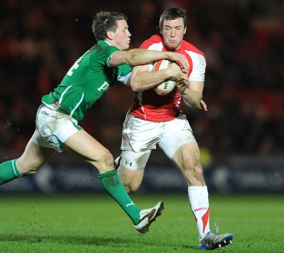 11.03.11 - Wales Under 20 v Ireland Under 20 - Under 20 Six Nations - Adam Warren of Wales takes on Craig Gilroy of Ireland. 