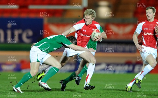 11.03.11 - Wales Under 20 v Ireland Under 20 - Under 20 Six Nations - Ben John of Wales takes on Craig Gilroy of Ireland. 