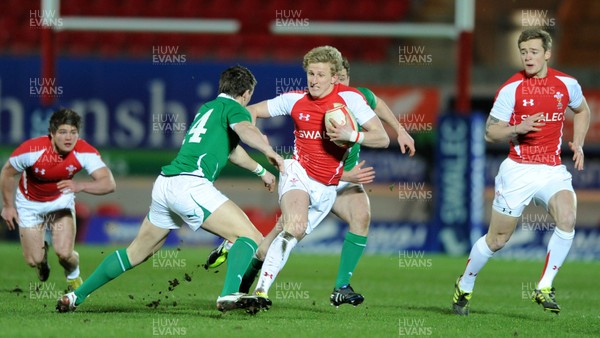 11.03.11 - Wales Under 20 v Ireland Under 20 - Under 20 Six Nations - Ben John of Wales takes on Craig Gilroy of Ireland. 
