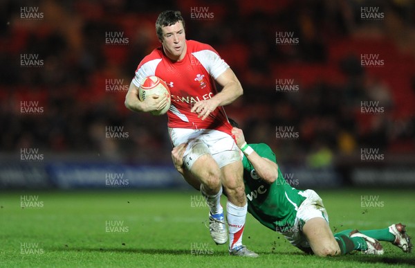 11.03.11 - Wales Under 20 v Ireland Under 20 - Under 20 Six Nations - Adam Warren of Wales takes on Craig Gilroy of Ireland. 