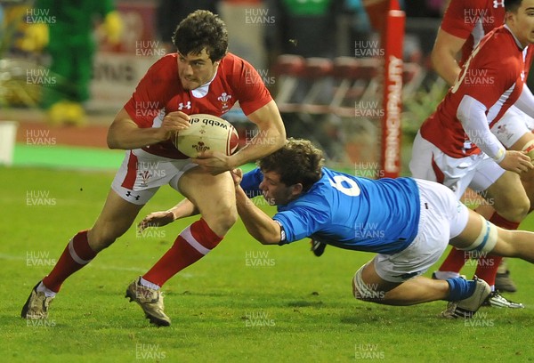 090312 - Wales U20 v Italy U20s- 6 Nations Rugby Wales' Luke Morgan, left, avoids the tackle by Italy's Jacopo Salvetti