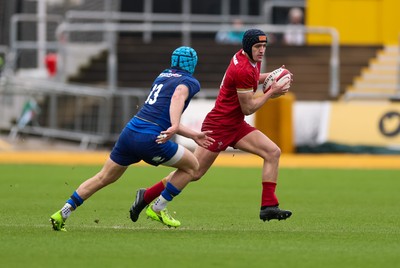 150326 - Wales v Italy, U20 Six Nations 2026 - Dylan Scott of Wales takes on Luca De Novellis of Italy