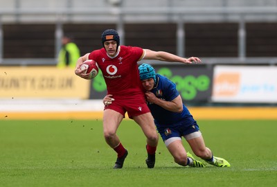 150326 - Wales v Italy, U20 Six Nations 2026 - Dylan Scott of Wales takes on Luca De Novellis of Italy