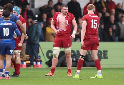 150326 - Wales v Italy, U20 Six Nations 2026 - Luke Evans of Wales ends up with a ripped shirt after the teams square up to one another