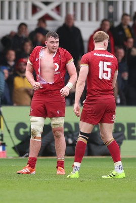 150326 - Wales v Italy, U20 Six Nations 2026 - Luke Evans of Wales ends up with a ripped shirt after the teams square up to one another